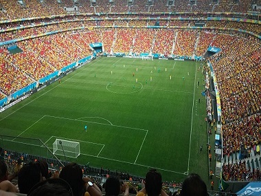 Image of a football game of the FIFA World Cup in front of a full stadium
